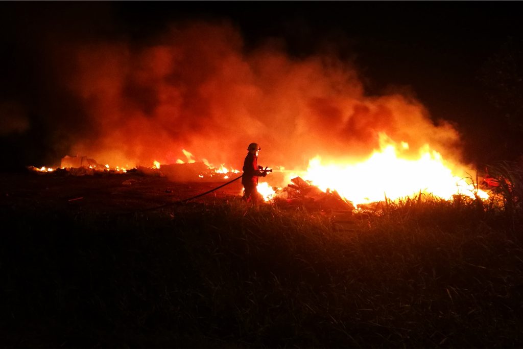 Firefighter trying to stop a bushfire in Malacca, Malaysia. Bushfires, Climate Change and the Lessons From the Past Decade